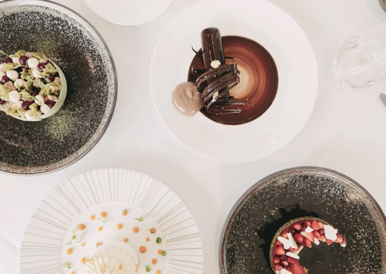 Artistic dessert presentation featuring a chocolate twist and berry tart, offering a sense of indulgence perfect for culinary enthusiasts.