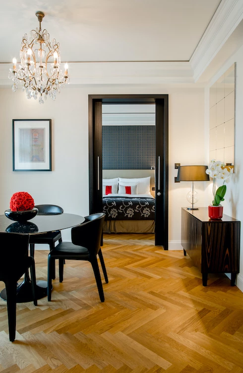 Lush golf course with vivid green grass and bright pink blossoms, offers a serene and inviting setting for golf enthusiasts.