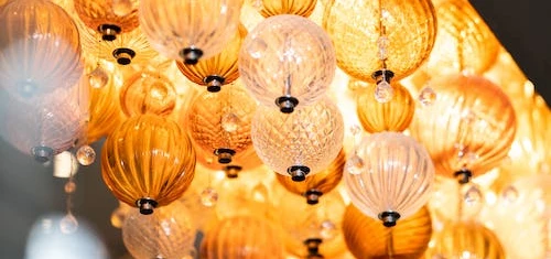 Woman in white robe examining a skincare product, exuding a serene and calming vibe, ideal for the wellness and beauty industry.